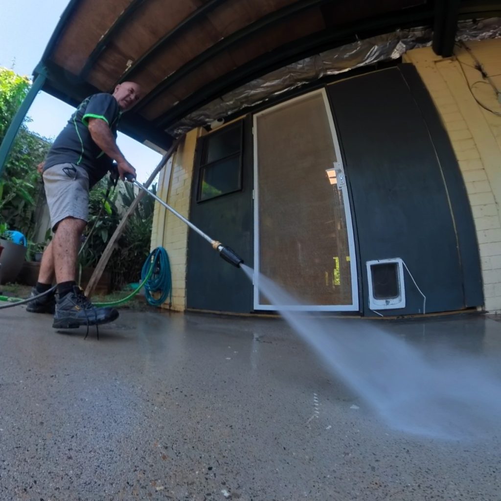 Dallas with the pressure cleaning hose